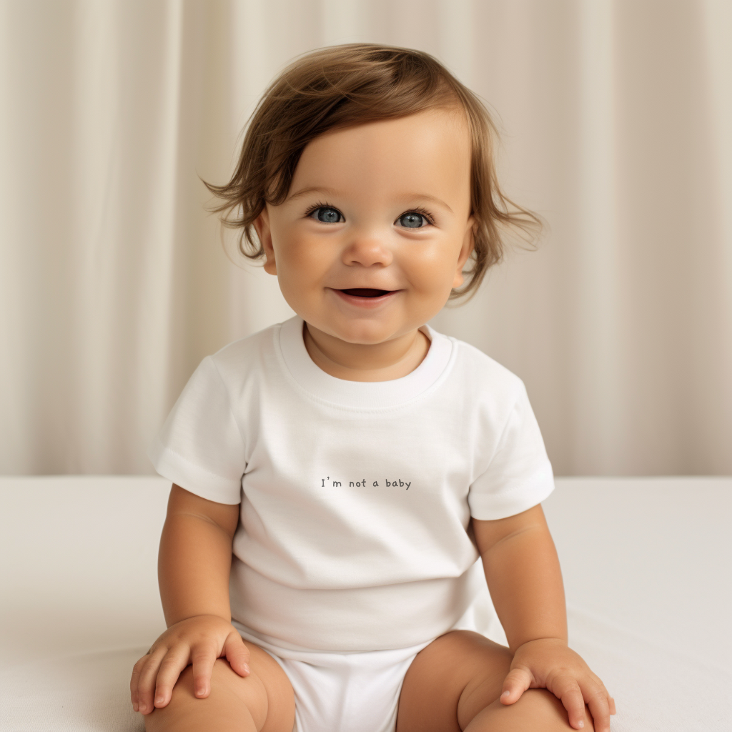 happy baby wearing white t-shirt